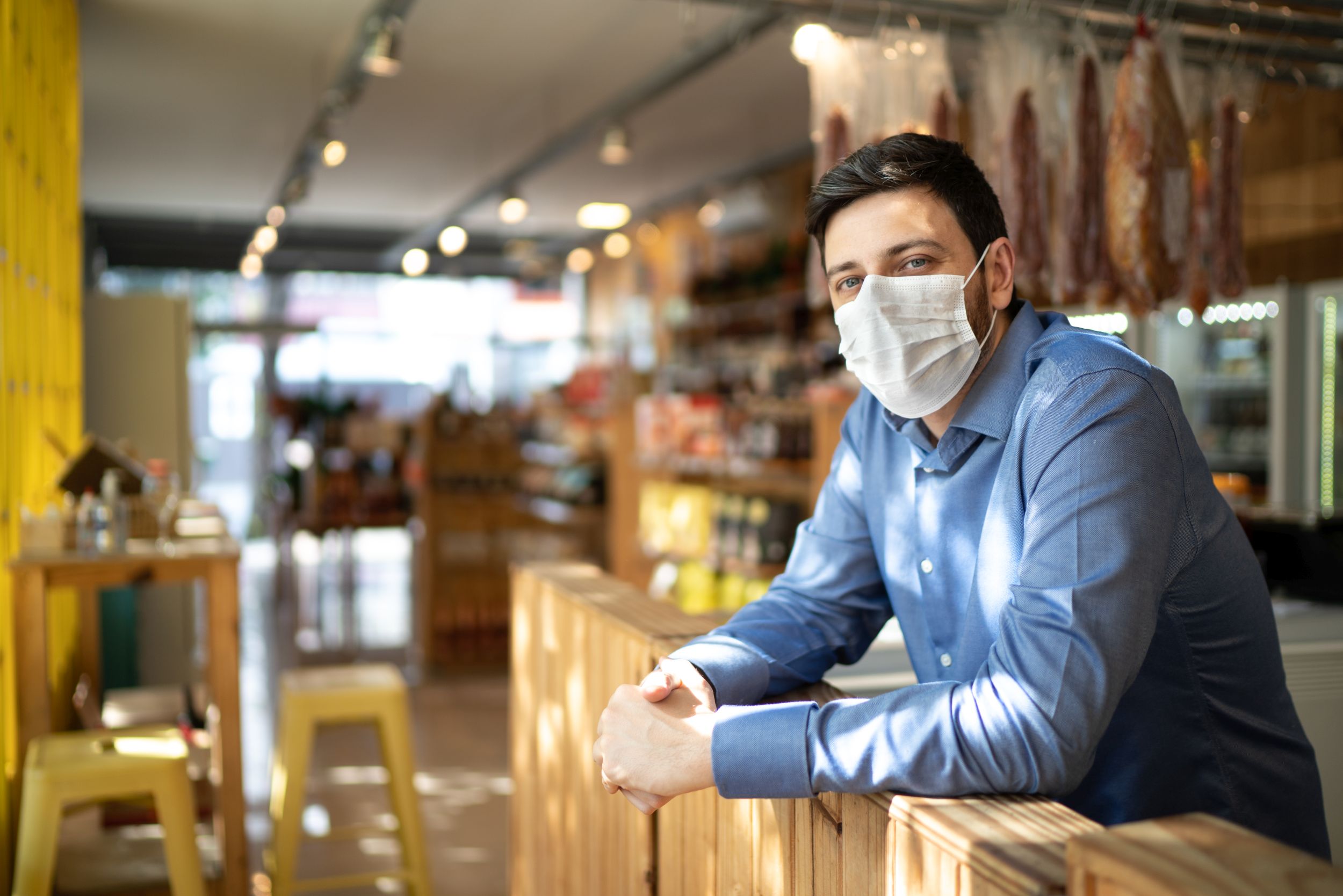 Portrait of small business man owner with face mask
